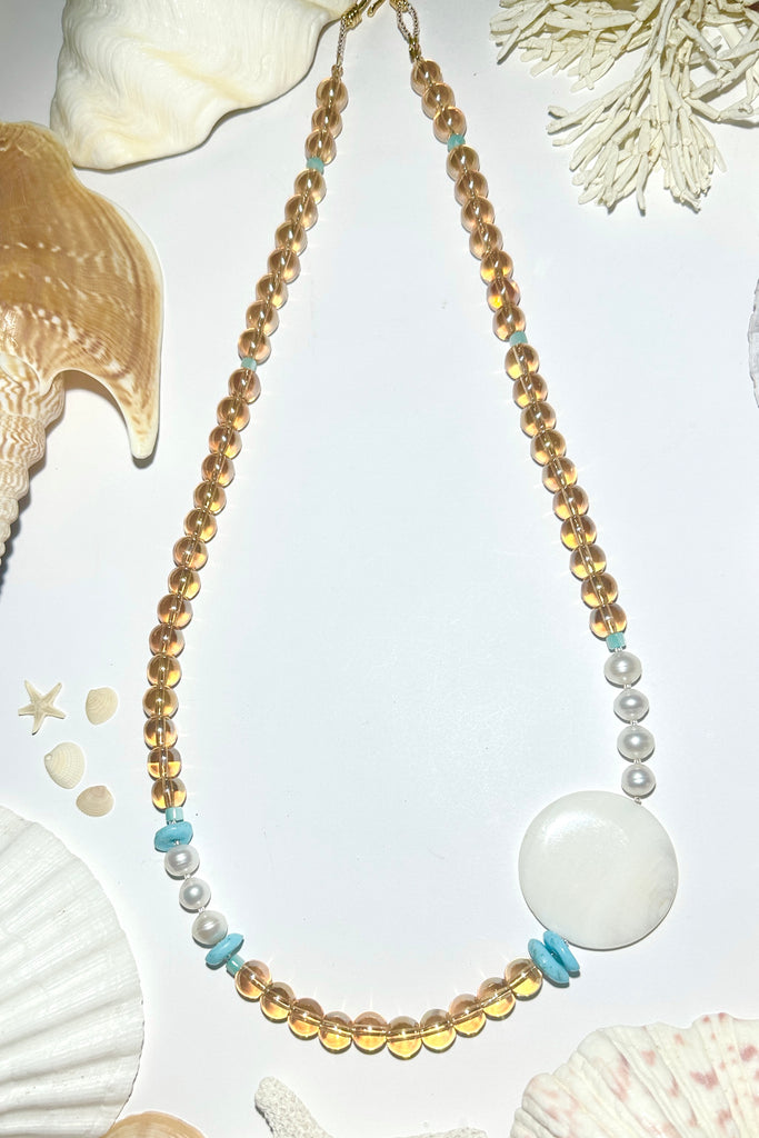 Floating bubbles of golden crystal, luminescent pearls and Mother of Pearl a ocean inspired necklace for a mermaid.