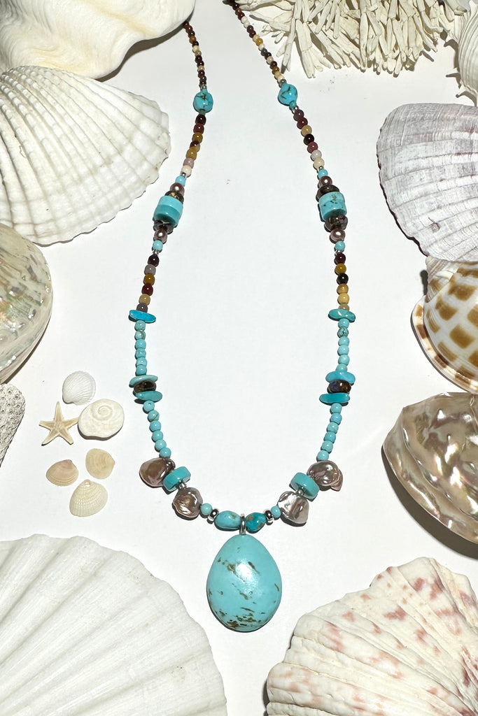 necklace perfect for summer.

Natural Turquoise with rock inclusions, Australian Mookaite beads, Australian Boulder Opal beads, baroque Pearls Natural Kingman Turquoise beads and round Howlite beads.