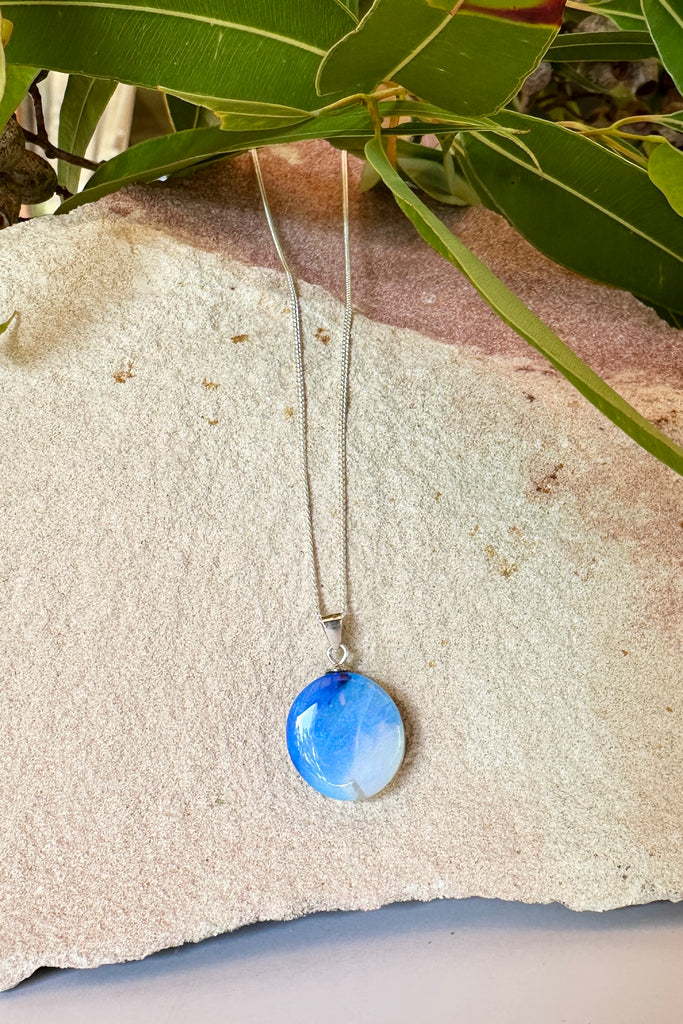 this Australian Opal pendant has shades of blue to silvery grey.

10.62ct Solid Australian boulder Opal.