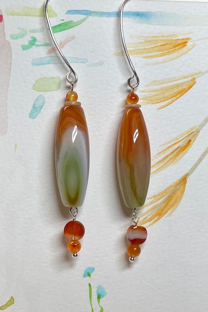 Drop style earrings statement earrings. 925 silver hook earrings. Stones are Coloured Agate, Carnelian and seashell.