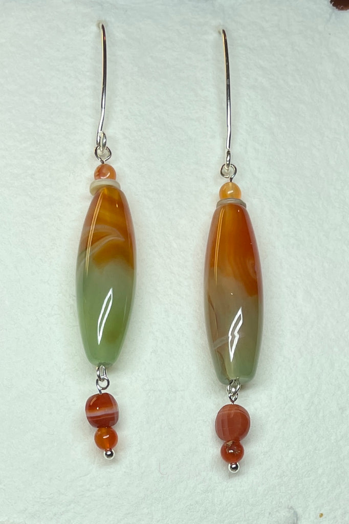 Drop style earrings statement earrings. 925 silver hook earrings. Stones are Coloured Agate, Carnelian and seashell.