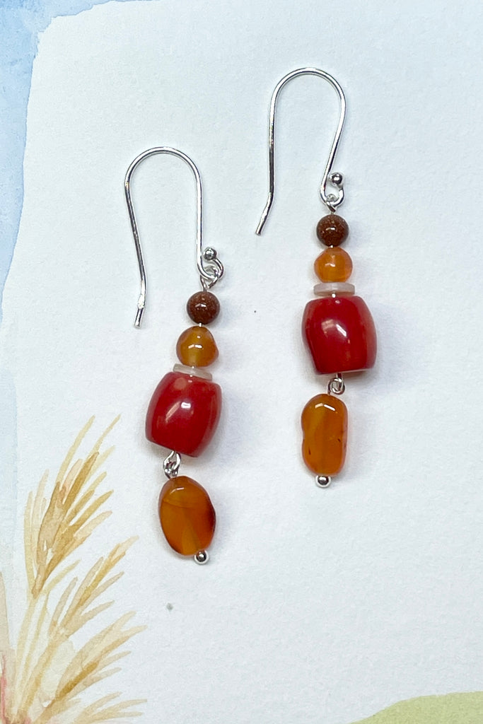 Drop style earrings statement earrings. 925 silver hook earrings. Stones are Carnelian, Sunstone Coloured Branch Coral and seashell.