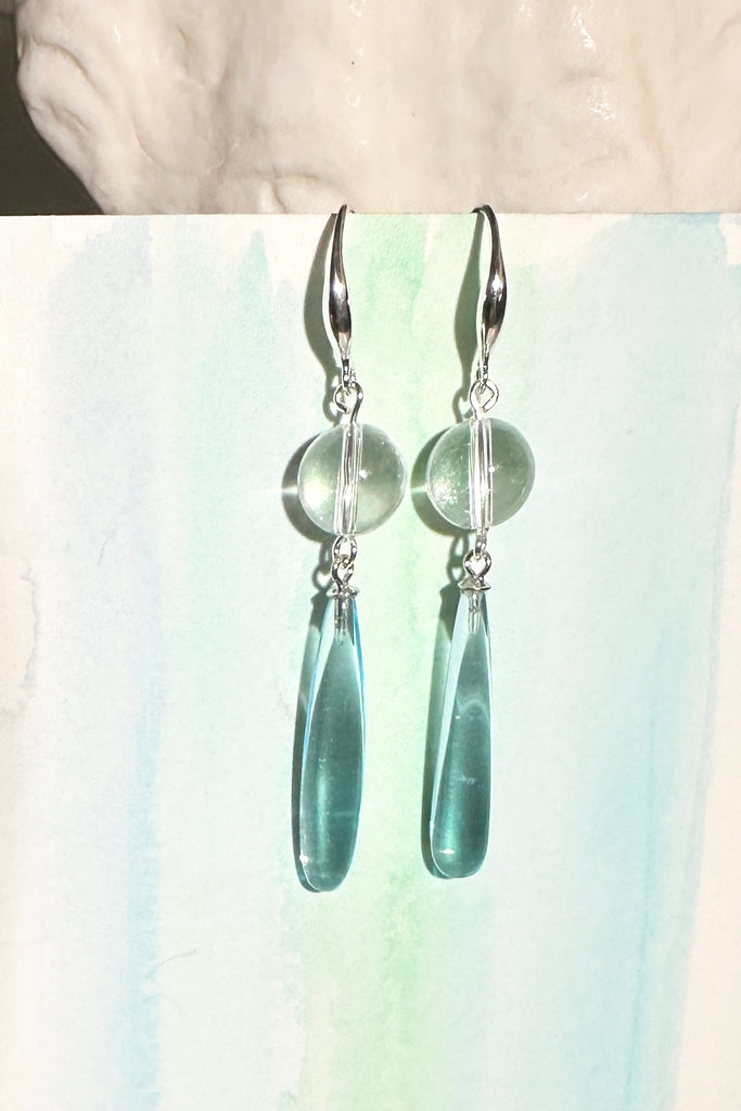 Drop earrings as pretty as the wave spray, a perfect clear sky blue. A bead of perfect Rock Crystal at the top.

Clear sky blue with a Rock Crystal bead.