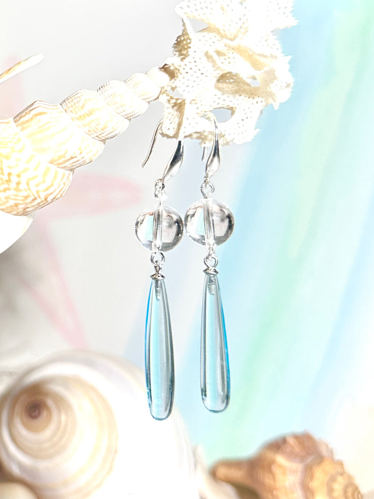 Drop earrings as pretty as the wave spray, a perfect clear sky blue. A bead of perfect Rock Crystal at the top.

Clear sky blue with a Rock Crystal bead.