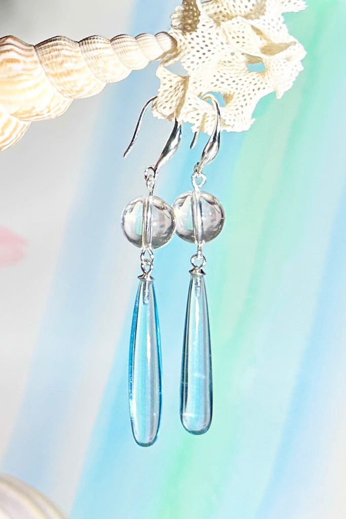 Drop earrings as pretty as the wave spray, a perfect clear sky blue. A bead of perfect Rock Crystal at the top.

Clear sky blue with a Rock Crystal bead.