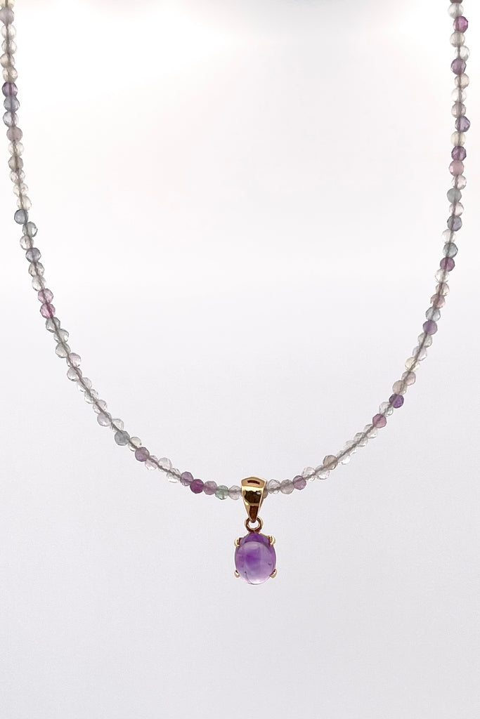 A delicate choker style necklace made with very tiny faceted and polished Fluorite beads, the centre piece is a pretty Amethyst cabochon set in gold vermeil. Made for Mombasa Rose Boutique in Noosa Australia.