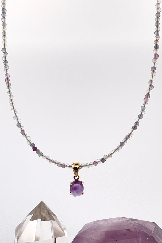 A delicate choker style necklace made with very tiny faceted and polished Fluorite beads, the centre piece is a pretty Amethyst cabochon set in gold vermeil. Made for Mombasa Rose Boutique in Noosa Australia.