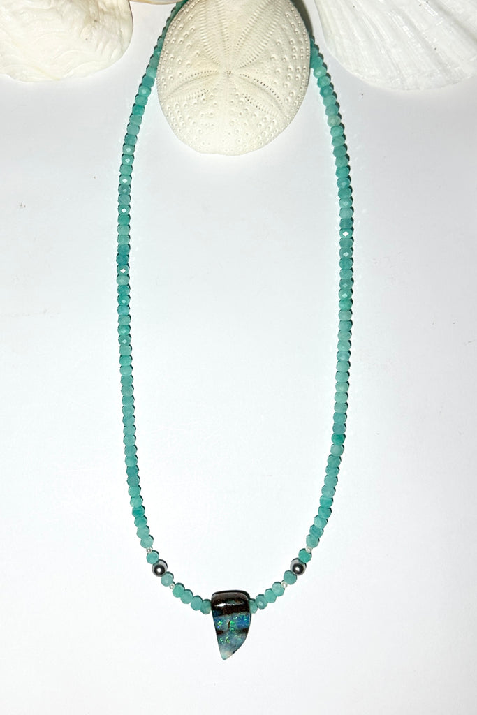This Opal necklace has river of pale sky blue Amazonite beads and two tiny silver grey pearls, at the centre is a lake of teal blue water.

Boulder opal stone, flashing green, teal and misty blue, faceted Amazonite beads and freshwater pearls.