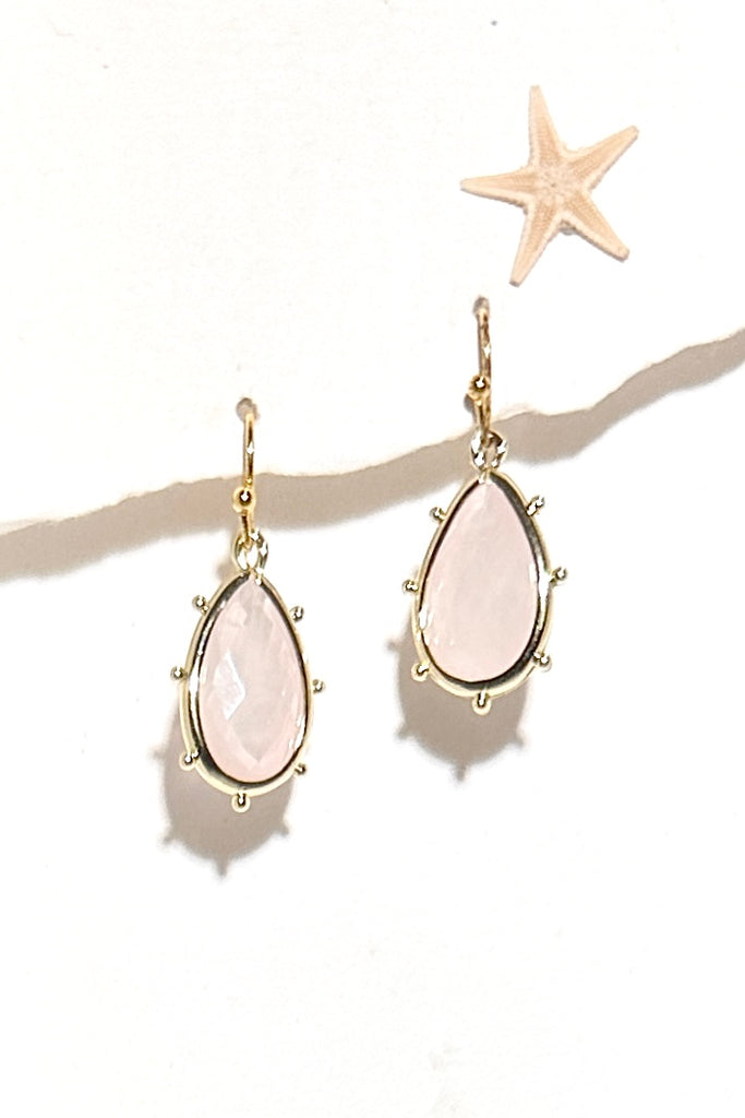 Drop style earrings.
Bezel set faceted pale Rose Quartz.