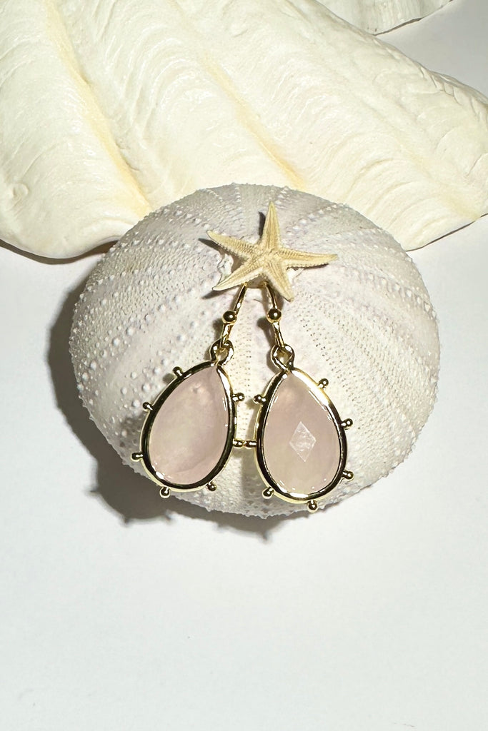 Drop style earrings.
Bezel set faceted pale Rose Quartz.
