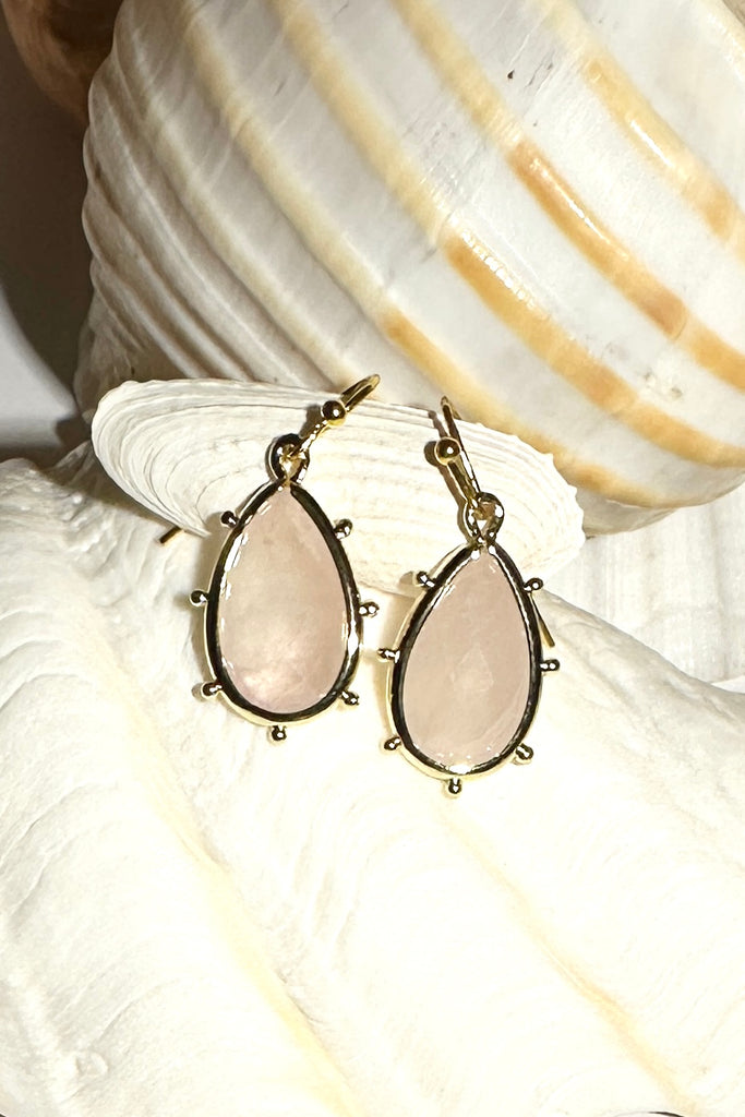 Drop style earrings.
Bezel set faceted pale Rose Quartz.