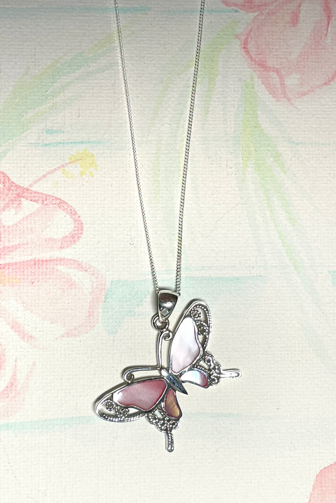 A charming butterfly necklace in shiny silver, with inlaid Mother of Pearl shell in palest pink..  