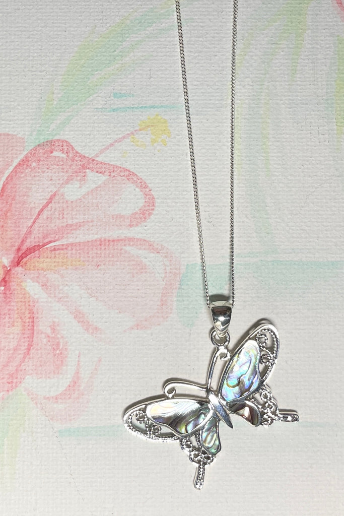 A charming butterfly necklace in shiny silver, with inlaid Mother of Pearl shell in palest pink..  