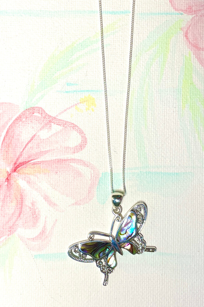 A charming butterfly necklace in shiny silver, with inlaid Mother of Pearl shell in palest pink..  