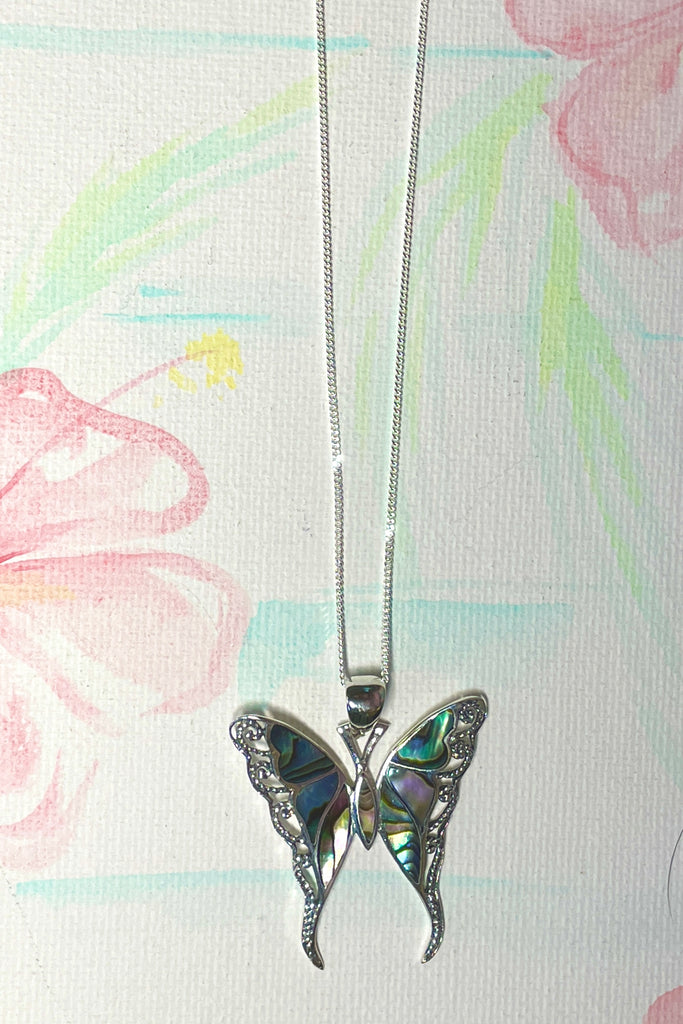 A charming butterfly necklace in shiny silver, with inlaid Mother of Pearl shell in palest pink..  
