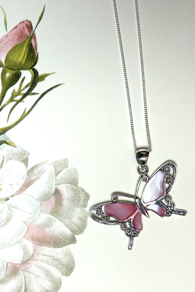 A charming butterfly necklace in shiny silver, with inlaid Mother of Pearl shell in palest pink..  