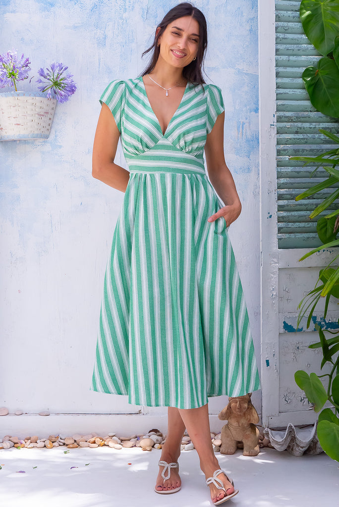 The Lizzie Palm Green Stripe Midi Dress is a gorgeous white and green striped midi dress. The dress features a basque waist, feminine cut and gathered bust. Made from 100% cotton. 