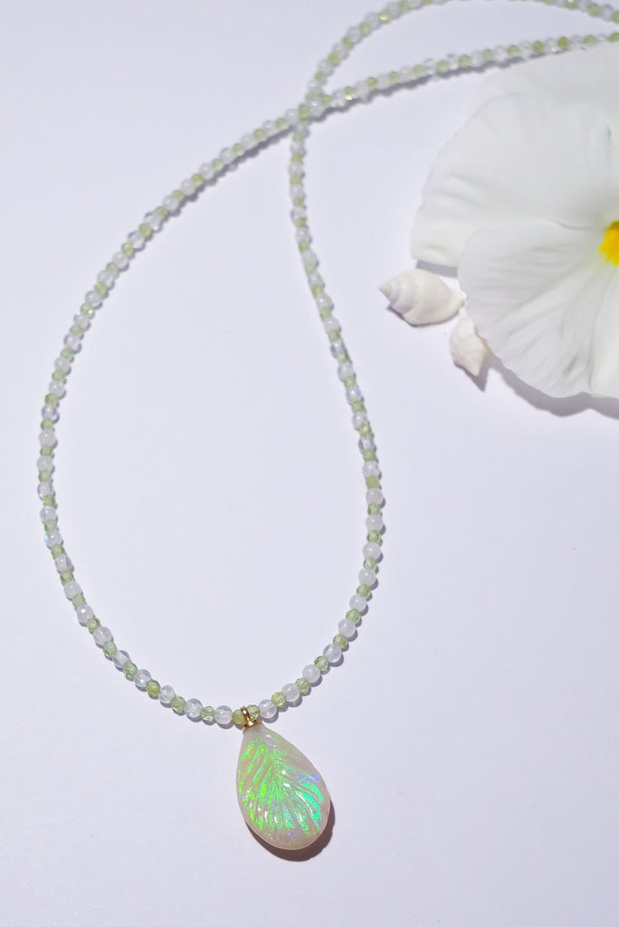 The enchanting soft green flashes of colour in this stunning opal leaf pendant are perfectly&nbsp;complimented by the delicate green of peridot and the magical shimmer of moonstone.