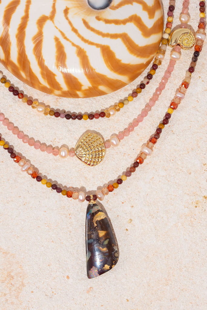Inspired by the colours of the great Australian Outback this radiant piece features both an Australian Opal and Australian Mookaite.