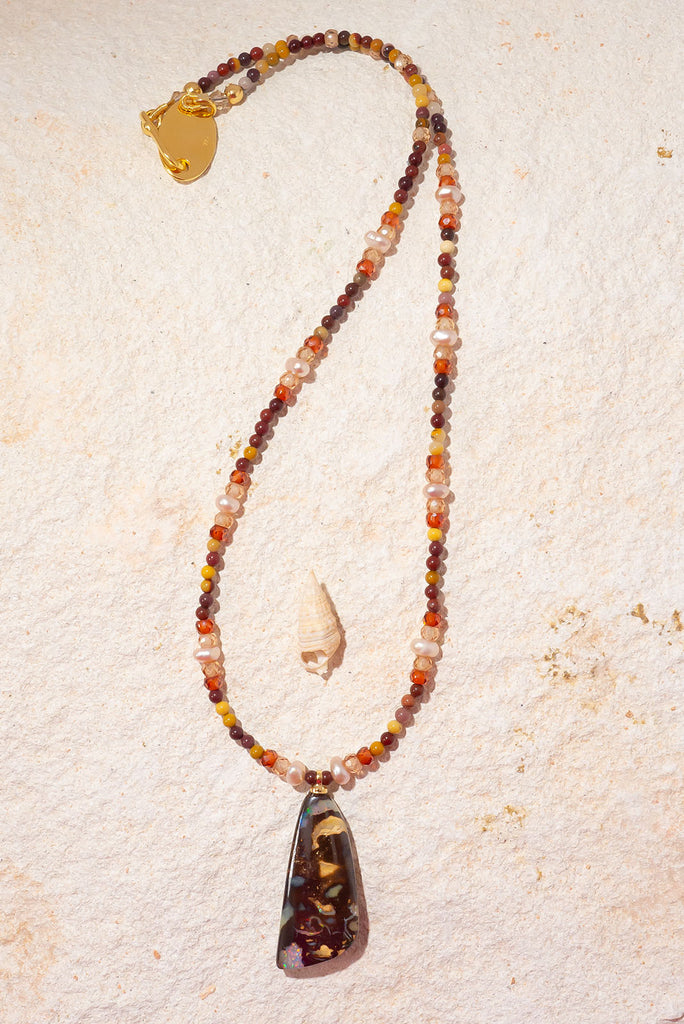 Inspired by the colours of the great Australian Outback this radiant piece features both an Australian Opal and Australian Mookaite.