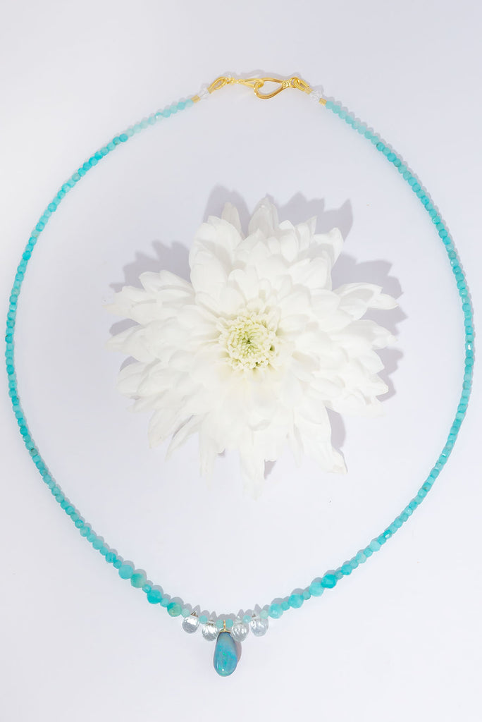 A gentle splash of ocean spray, this lovely Australian opal hangs from a necklace of tiny sparkling Amazonite beads with pale Aquamarine briolette stones as a highlight.