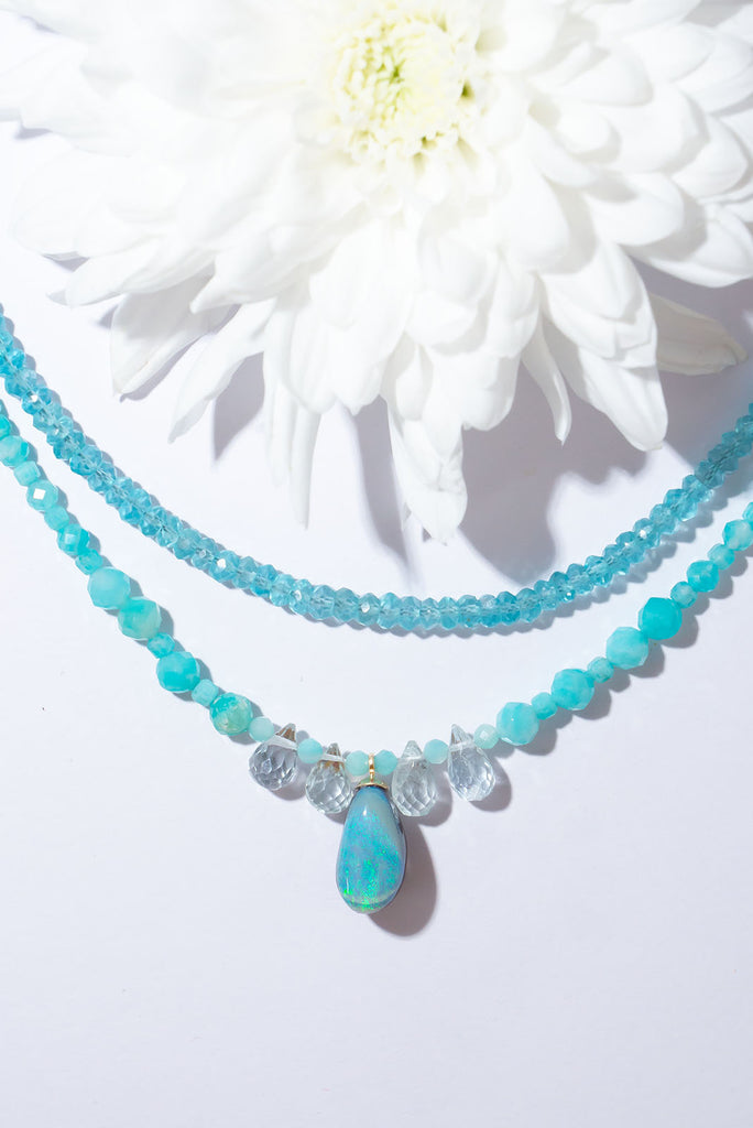 A gentle splash of ocean spray, this lovely Australian opal hangs from a necklace of tiny sparkling Amazonite beads with pale Aquamarine briolette stones as a highlight.