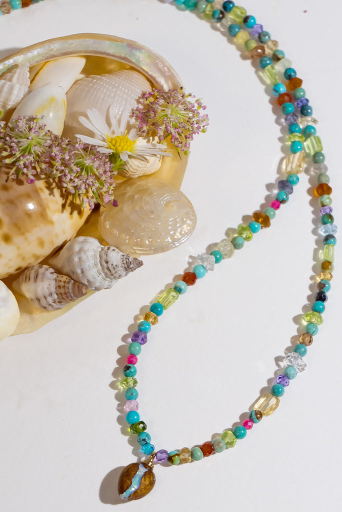 So pretty and modern, this teeny tiny&nbsp; opal is the centrepiece on a multi stone bead gemstone necklace that sparkles in the light.&nbsp;