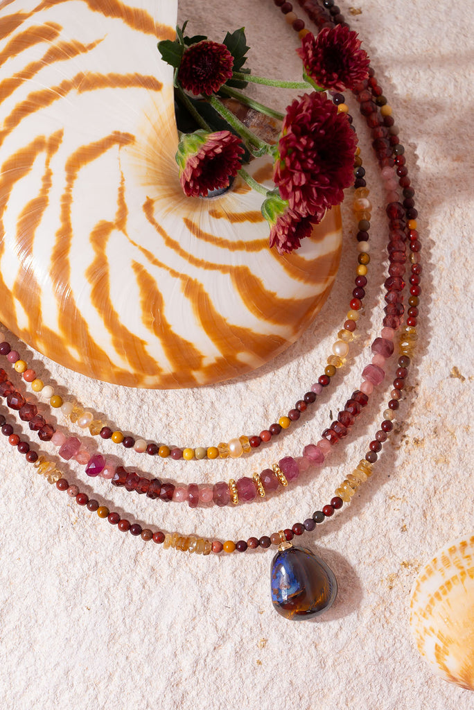 Rich with the tones of the beautiful Australian outback this beautiful necklace features 3 Australian mined gemstones including a beautiful solid Australian boulder opal pendant.