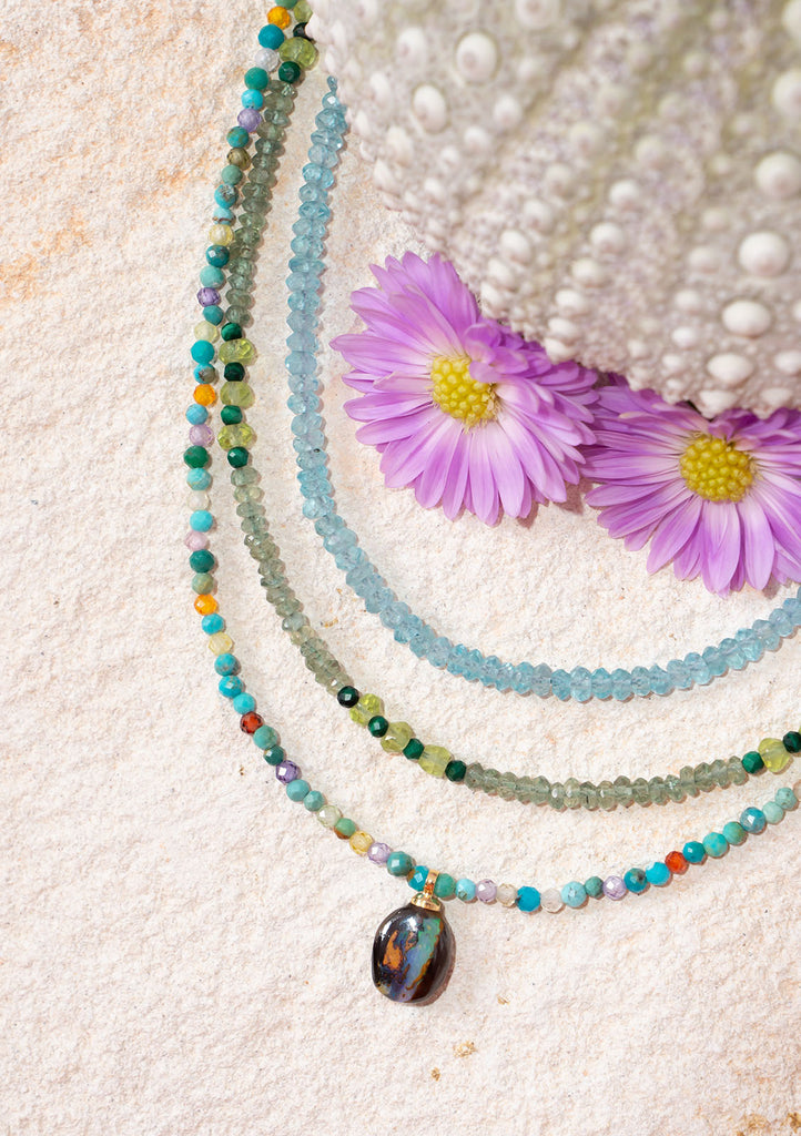 This gorgeous necklace features a delicate kaleidoscope of gemstone.
