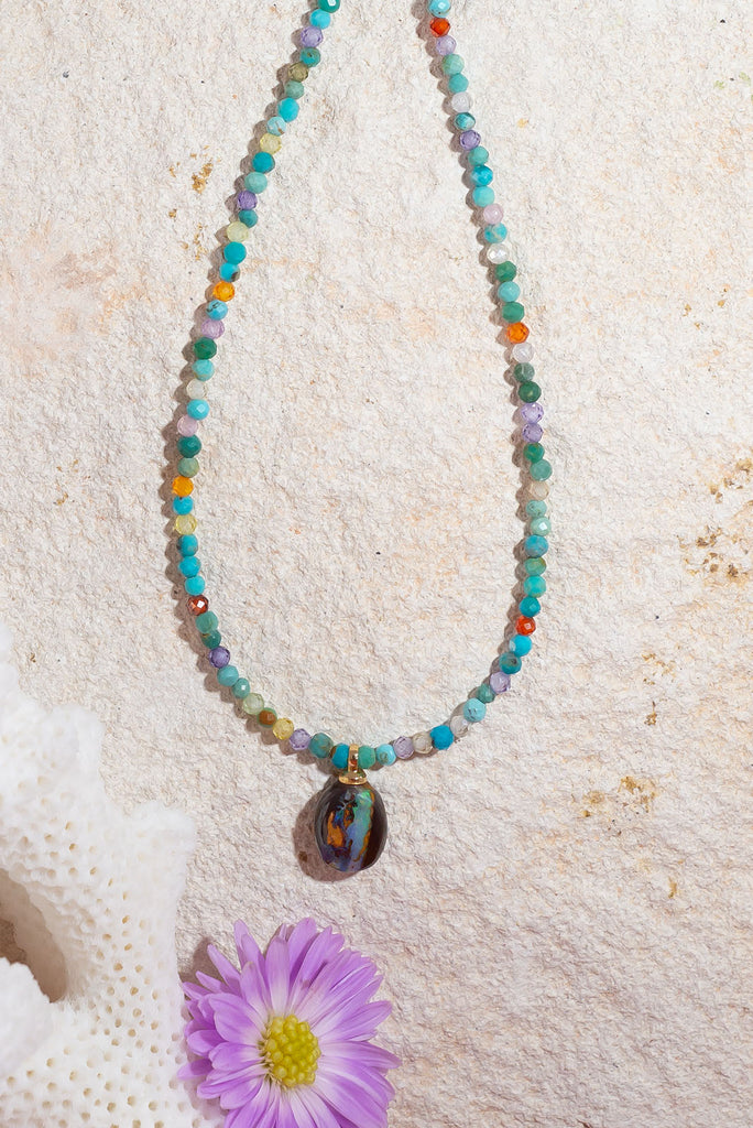 This gorgeous necklace features a delicate kaleidoscope of gemstone.
