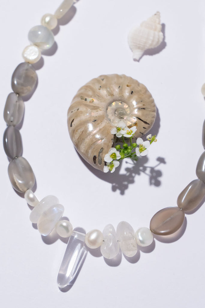 Like the soft shimmering swirls of an early misty morning our ethereal Necklace Cay Crystal Moon feels just a little bit magical.