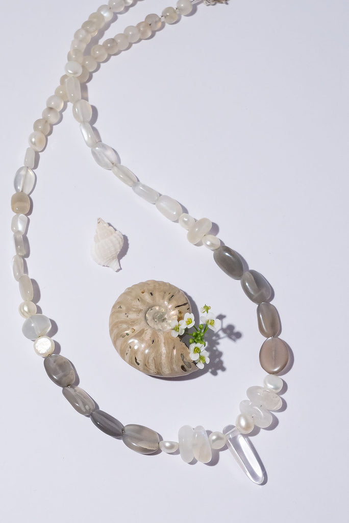 Like the soft shimmering swirls of an early misty morning our ethereal Necklace Cay Crystal Moon feels just a little bit magical.