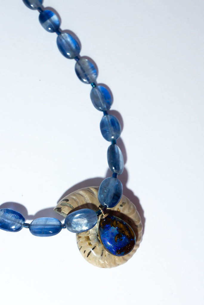 This gorgeous statement piece is an ode to the midnight sky with enthralling kyanite beads and a magical Australian Boulder opal.