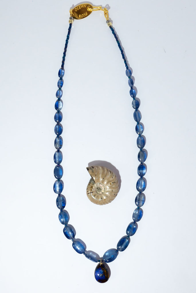 This gorgeous statement piece is an ode to the midnight sky with enthralling kyanite beads and a magical Australian Boulder opal.