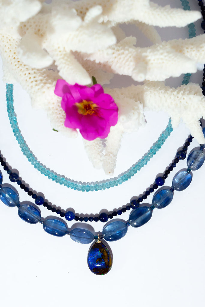 This gorgeous statement piece is an ode to the midnight sky with enthralling kyanite beads and a magical Australian Boulder opal.