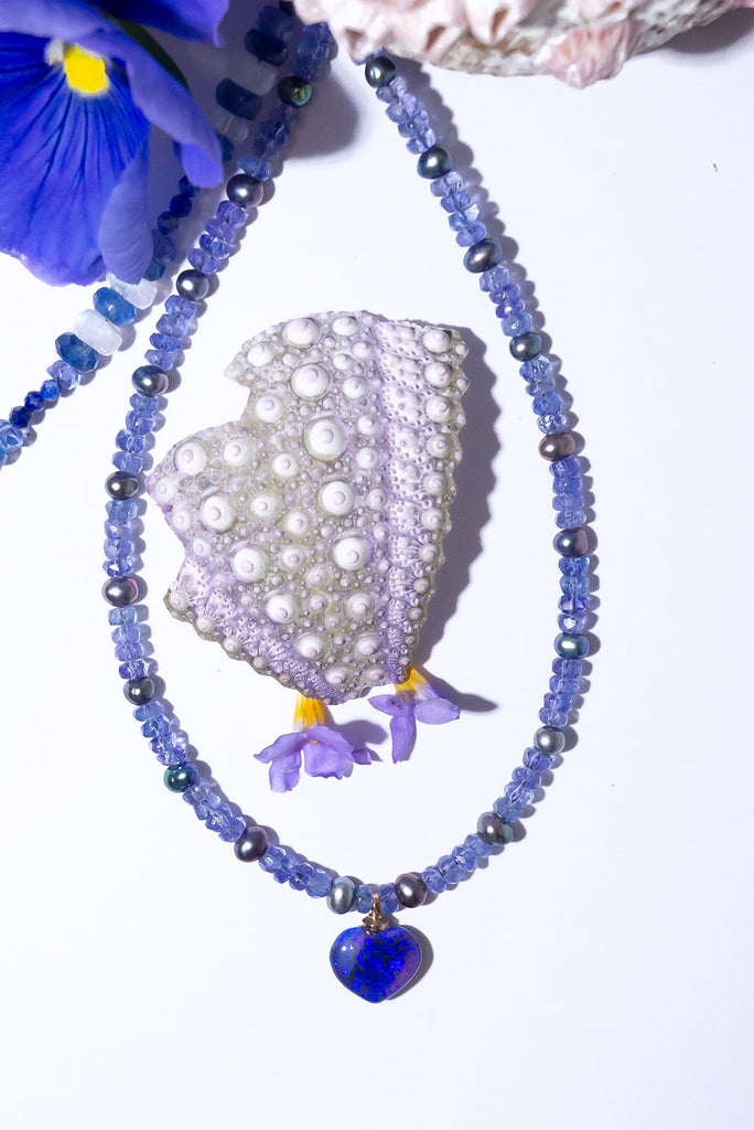 With a swirl of deep blue and dark purple colour flash in a beautiful Lightning Ridge Opal heart pendant you are sure to fall in love with our Necklace Gemstone Andromeda Mystery Love.