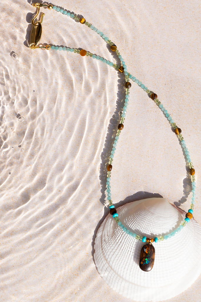 Reminiscent of cool ocean waves crash against the waterworn walls of an ancient sea grotto.