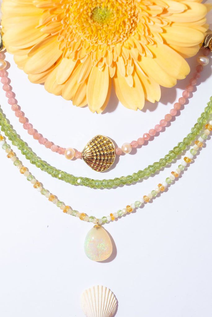 Glittering citrus shaded gemstones and a sparkling Australian opal make for a beautiful summery style.