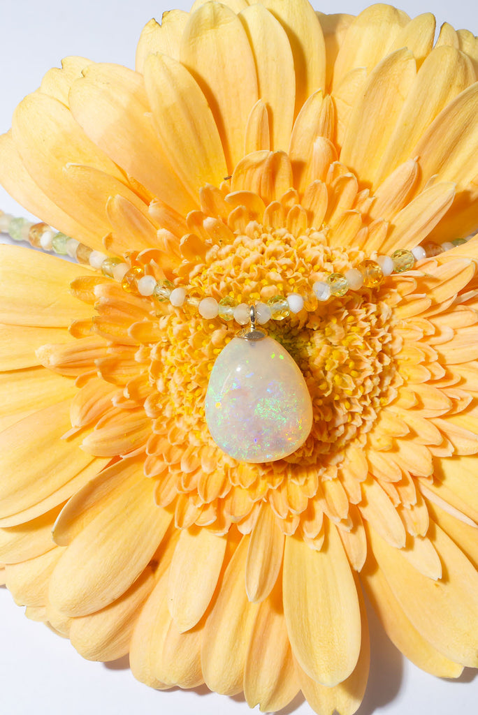Glittering citrus shaded gemstones and a sparkling Australian opal make for a beautiful summery style.