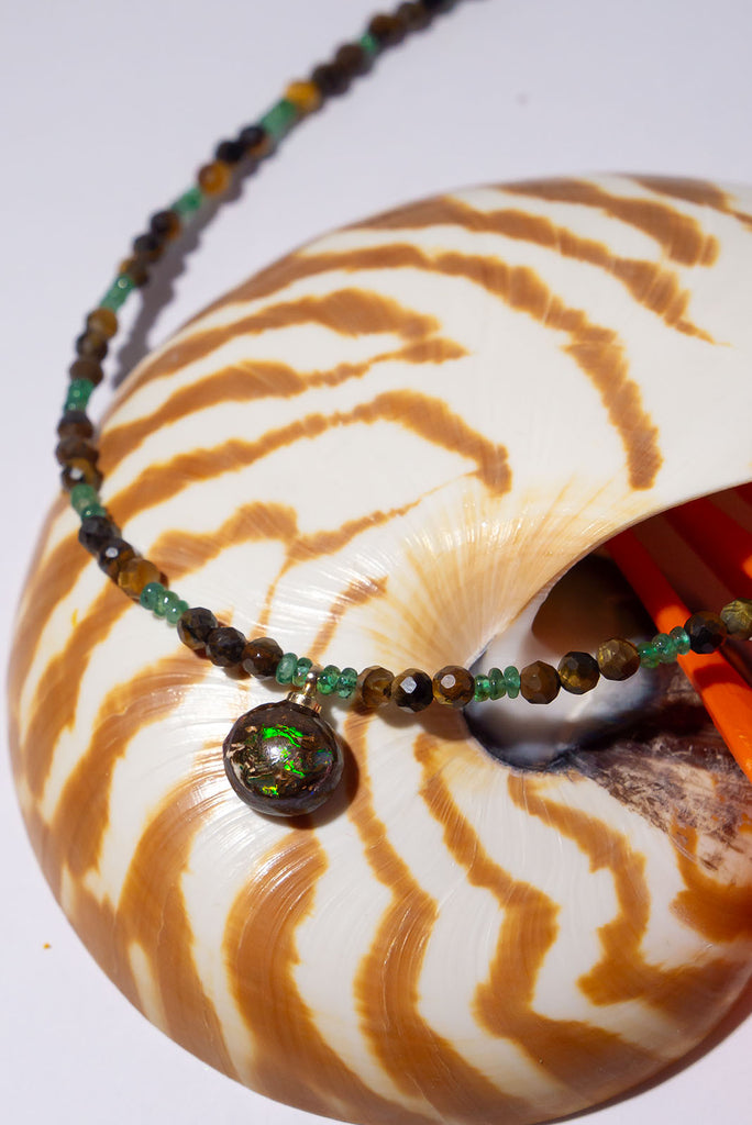 Shimmer and shine with this beautiful Australian Matrix Opal. Featuring gorgeous bright flashes of bright green with flecks of gold and blue.