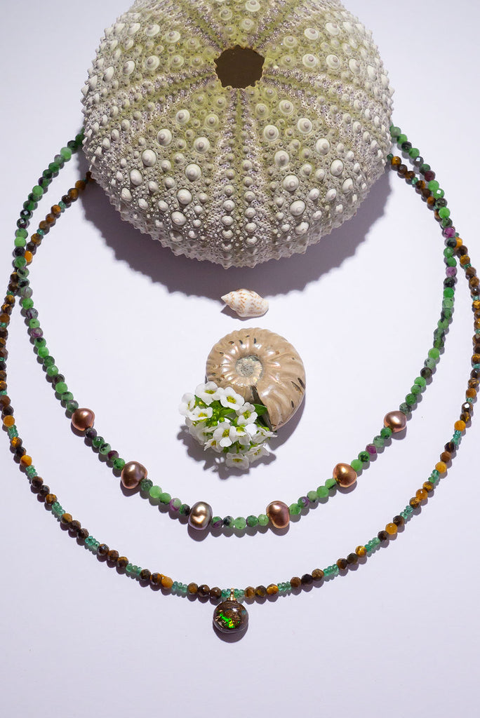Shimmer and shine with this beautiful Australian Matrix Opal. Featuring gorgeous bright flashes of bright green with flecks of gold and blue.