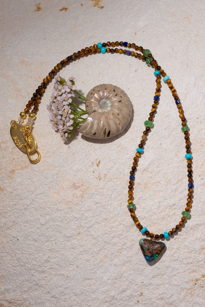 With shimmering greens, sky blues and deep rich brown this gorgeous necklace is inspired by the colour of the forest.