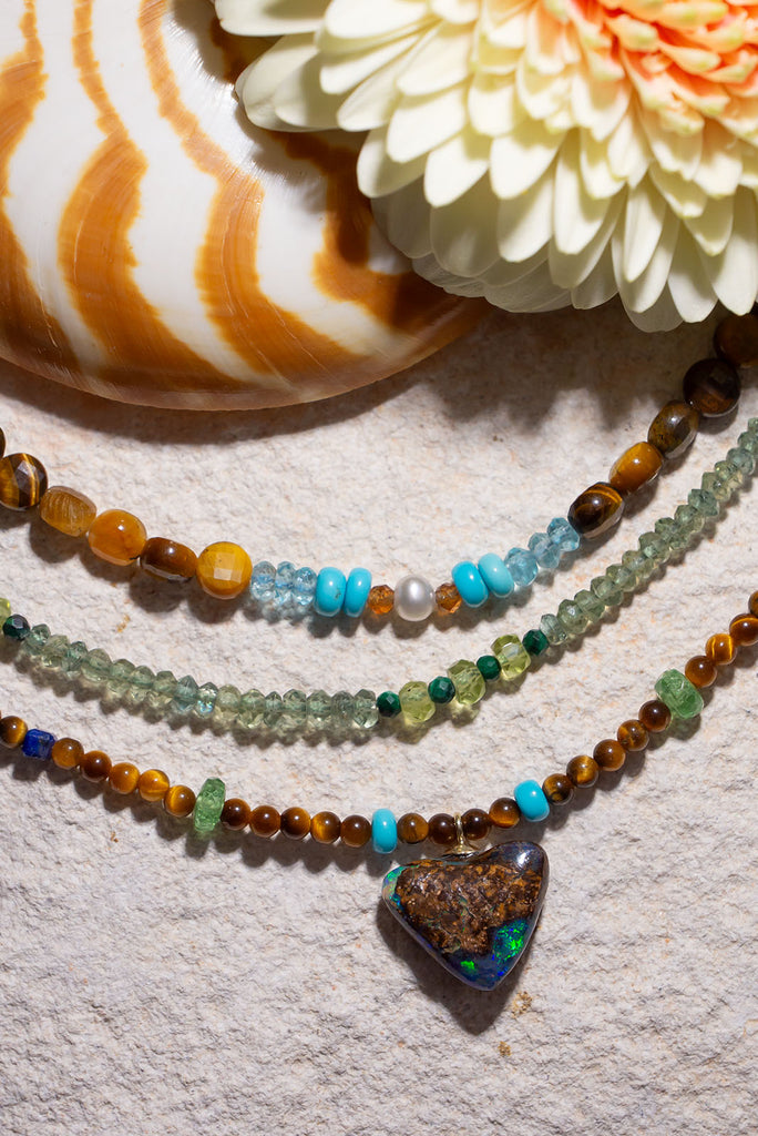 With shimmering greens, sky blues and deep rich brown this gorgeous necklace is inspired by the colour of the forest.