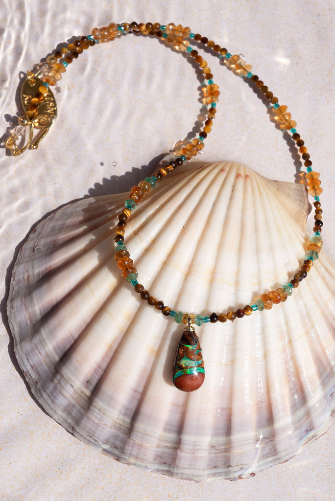 With cool rivers of aqua running through this stunning Australian opal you are sure to fall in love with this gorgeous piece.