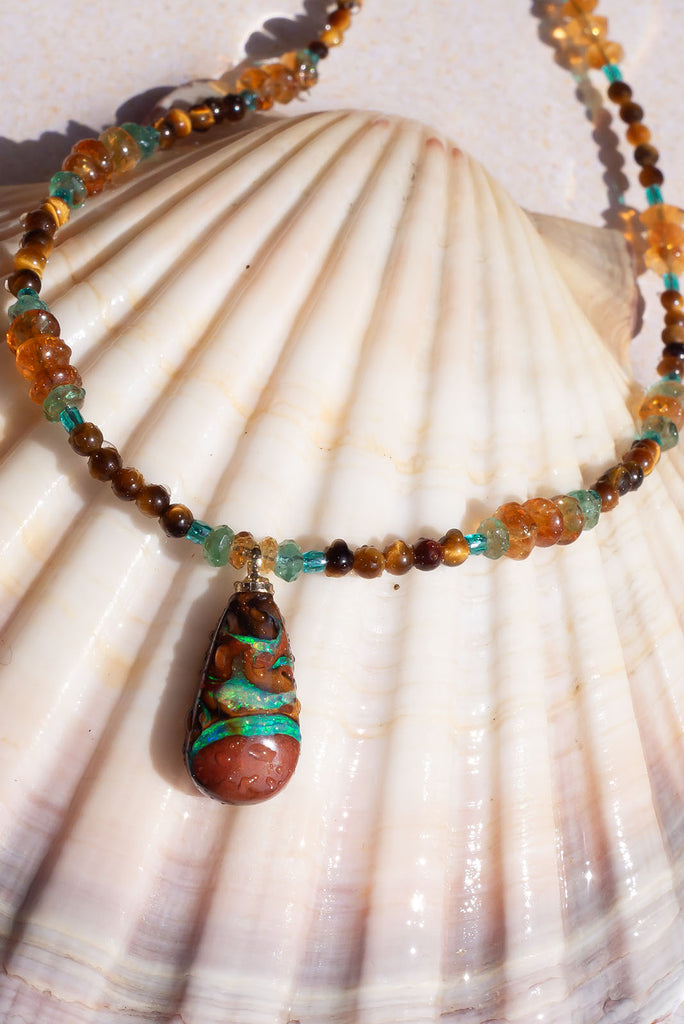 With cool rivers of aqua running through this stunning Australian opal you are sure to fall in love with this gorgeous piece.