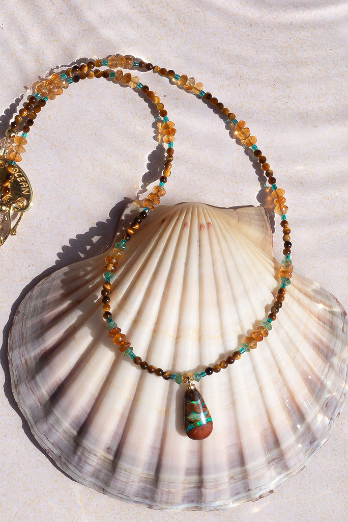 With cool rivers of aqua running through this stunning Australian opal you are sure to fall in love with this gorgeous piece.