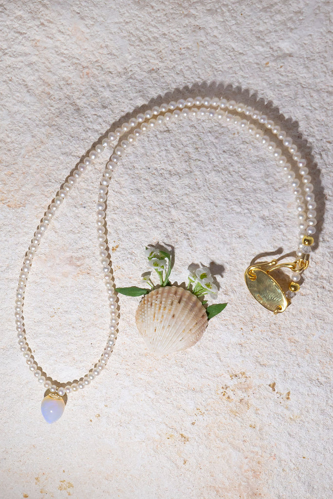 This gorgeous dewdrop of solid Australian jelly opal has a enchanting ethereal glow.