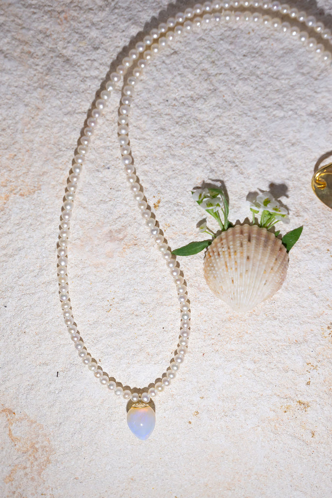 This gorgeous dewdrop of solid Australian jelly opal has a enchanting ethereal glow.