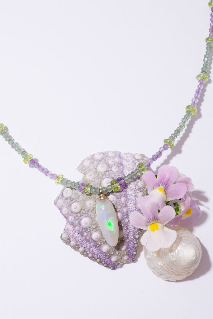With soft shades of leaf green and periwinkle this delicate gemstone necklace is reminiscent of a beautiful blooming Hydrangea.