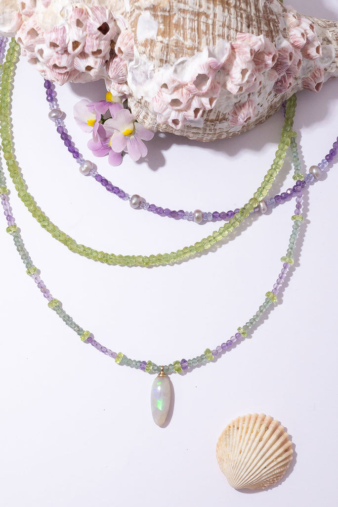 With soft shades of leaf green and periwinkle this delicate gemstone necklace is reminiscent of a beautiful blooming Hydrangea.